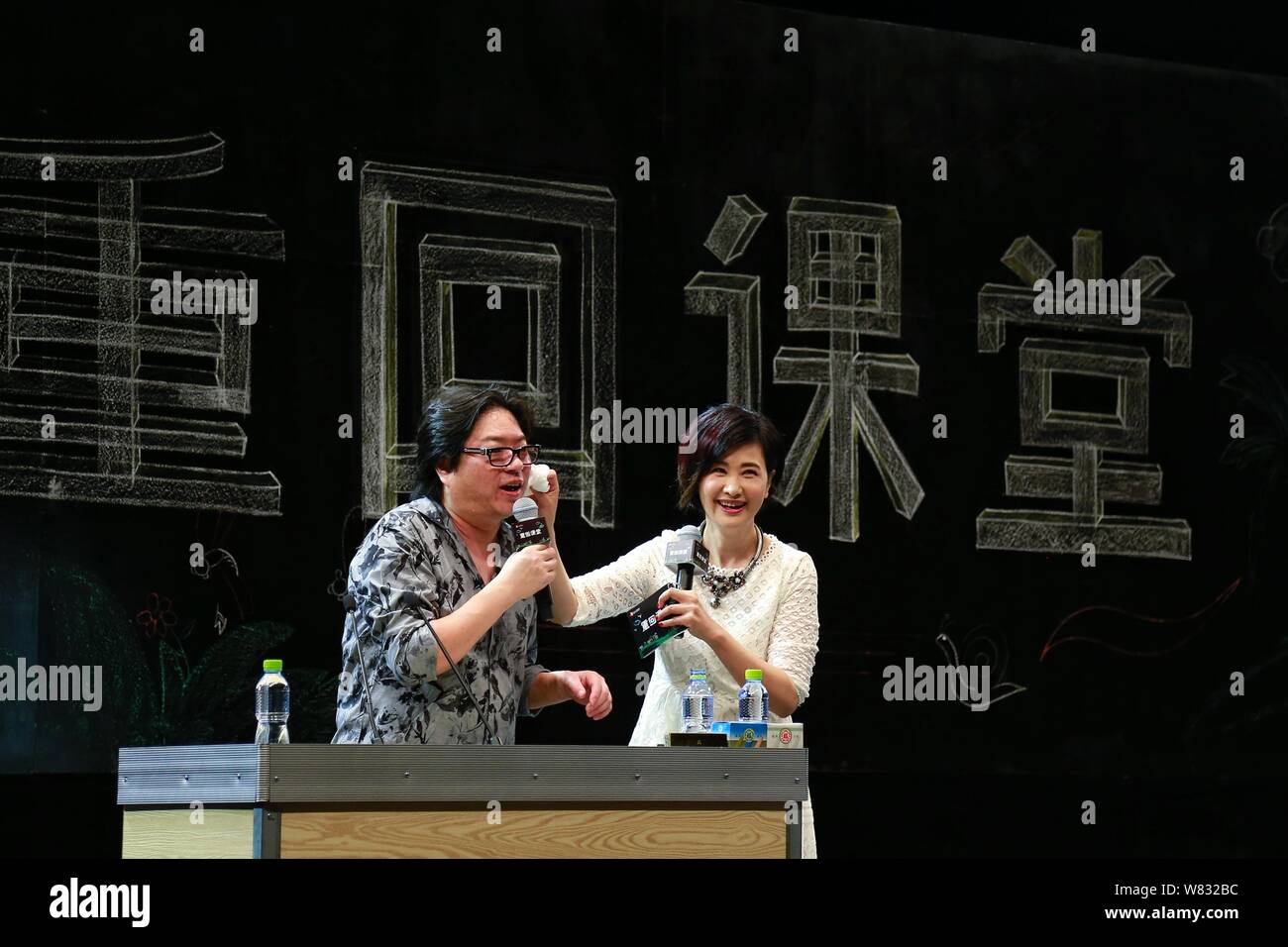 Chinese music producer Gao Xiaosong, left, Chairman of Alibaba Entertainment Strategic Committee and co-founder of Alibaba Music Group, gives a lesson Stock Photo