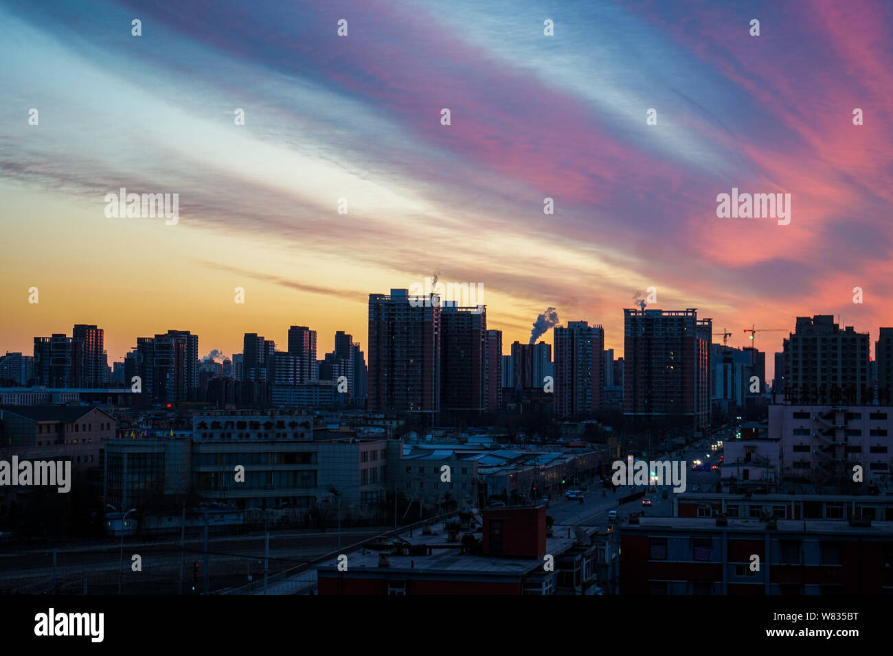 View of colorful sky at sunrise in Beijing, China, 10 January 2017.   Colorful skies greeted early risers in Beijing on Tuesday (10 January 2017). Bei Stock Photo