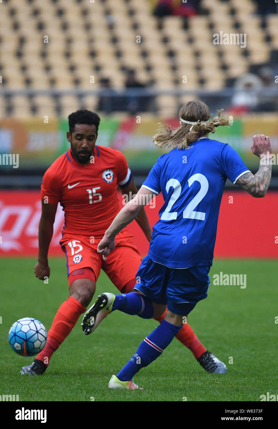 Jean Beausejour of Chile, left, challenges a player of Iceland in their final match during the 2017 Gree China Cup International Football Championship Stock Photo