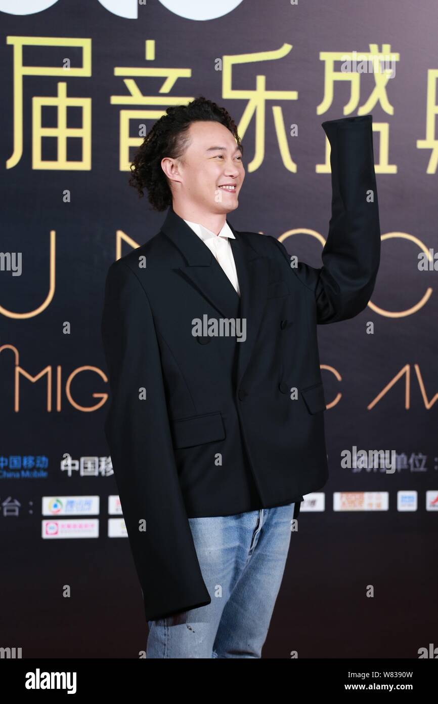 Hong Kong singer Eason Chan arrives on the red carpet for the 10th Migu
