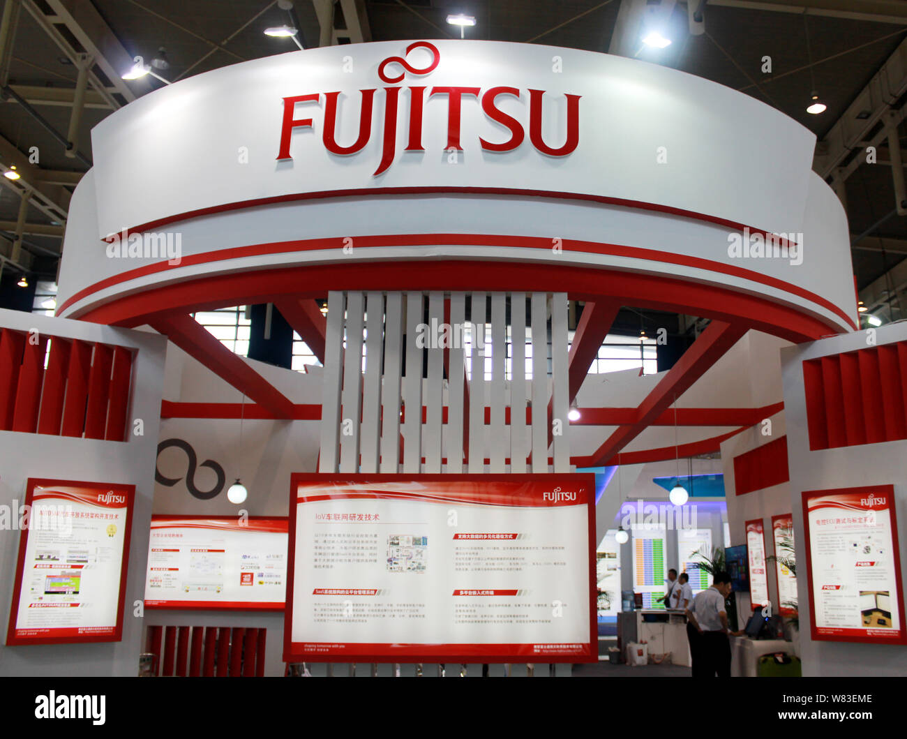 --FILE--People visit the stand of Fujitsu during an exhibition in Nanjing city, east China's Jiangsu province, 2 September 2016.   Fujitsu's president Stock Photo