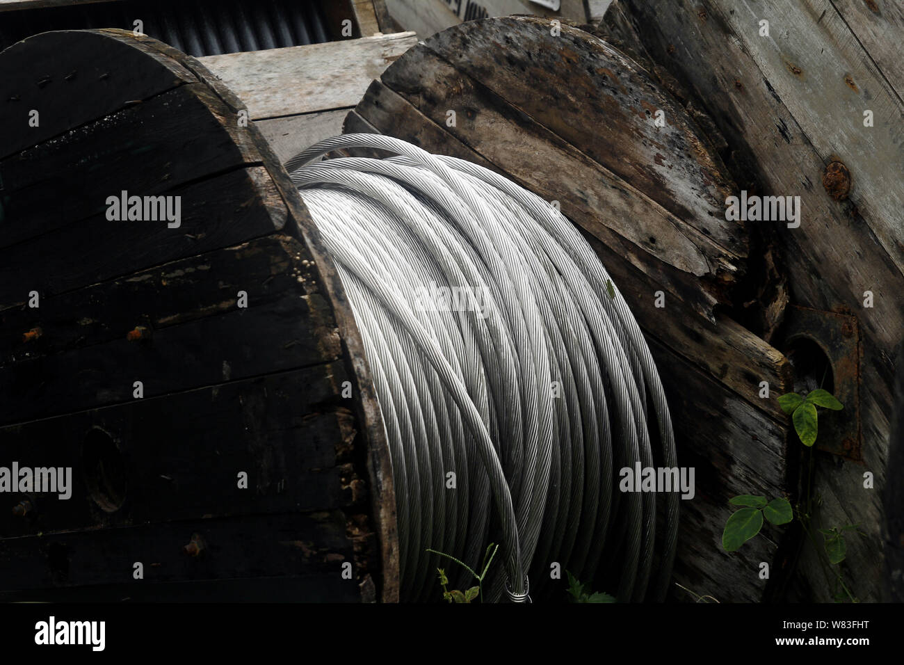 Photo of rolls of metal or steel cables used for electric poles at an industrial yard Stock Photo