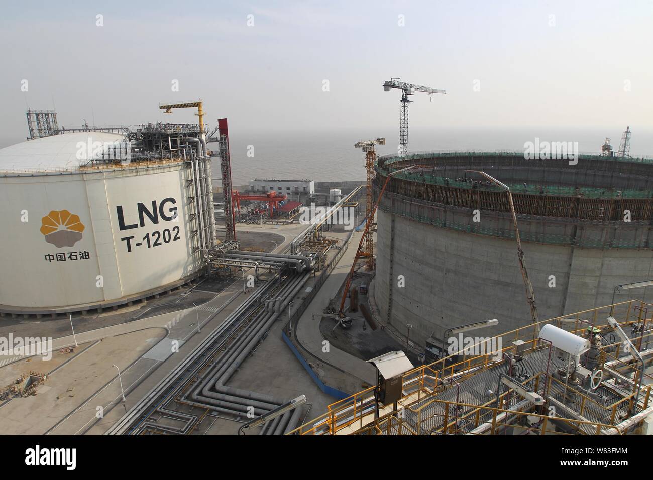 --FILE--An LNG (liquified natural gas) container of CNPC (China National Petroleum Corporation) is under construction next to others at the Yangkou Po Stock Photo
