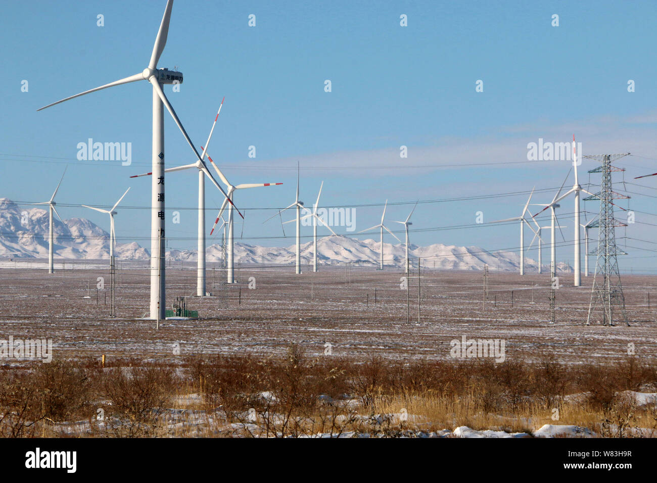 Wind turbines whirl to generate electricity at a wind farm in Alashankou city, Bortala Mongol Autonomous Prefecture, northwest China's Xinjiang Uygur Stock Photo