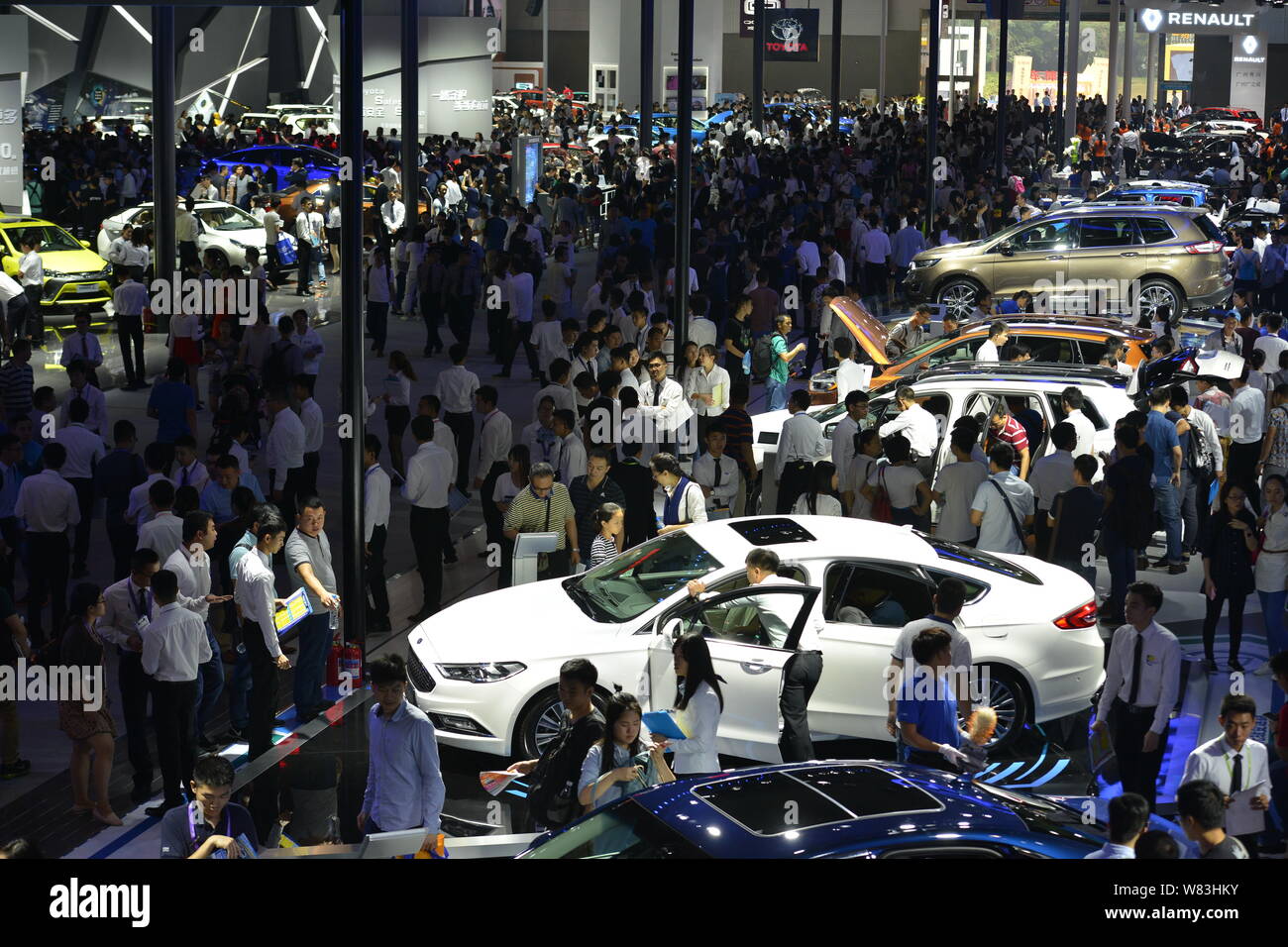 FILEVisitors crowd the stands of Toyota and Renault during the 14th