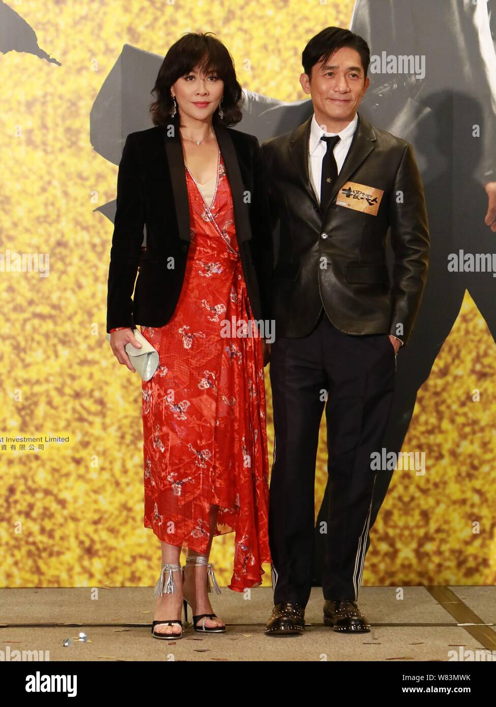 Hong Kong actor Tony Leung Chiu-wai, right, and his actress wife Carina Lau attend a charity premiere event for his new movie 'See You Tomorrow' in Ho Stock Photo