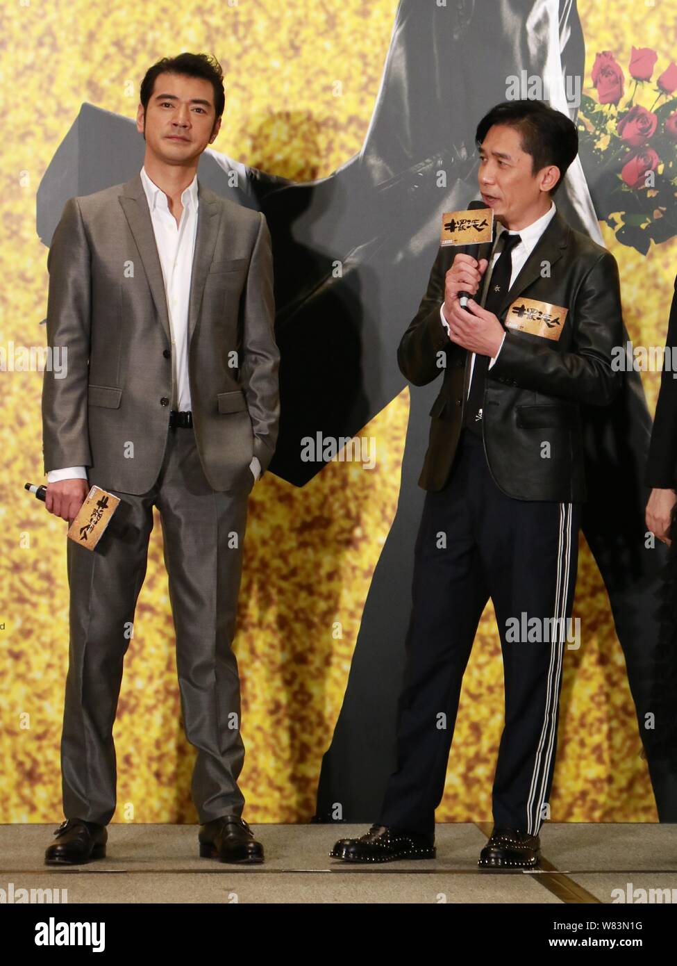 Hong Kong actor Tony Leung Chiu-wai, right, and Taiwanese-Japanese actor Takeshi Kaneshiro attend a charity premiere event for their new movie 'See Yo Stock Photo