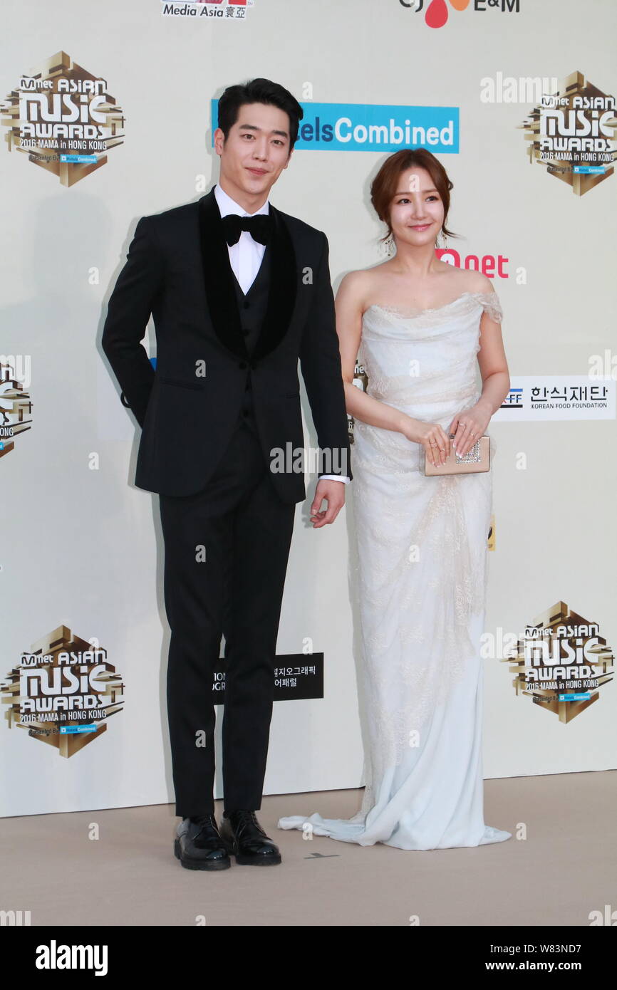 South Korean actress Park Min-young, right, and actor Seo Kang-joon arrive on the red carpet for the 2016 Mnet Asian Music Awards (MAMA) in Hong Kong, Stock Photo