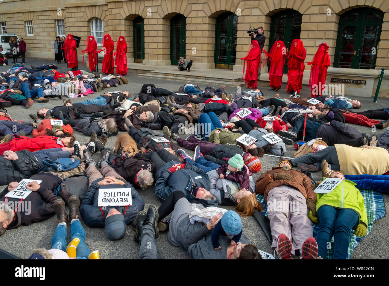Protestors at The Extinction Rebellion protest against climate change inaction, perform a 'die-in' outside the Tasmanian Parliament in Hobart, today (Thursday, August 8, 2019) Stock Photo