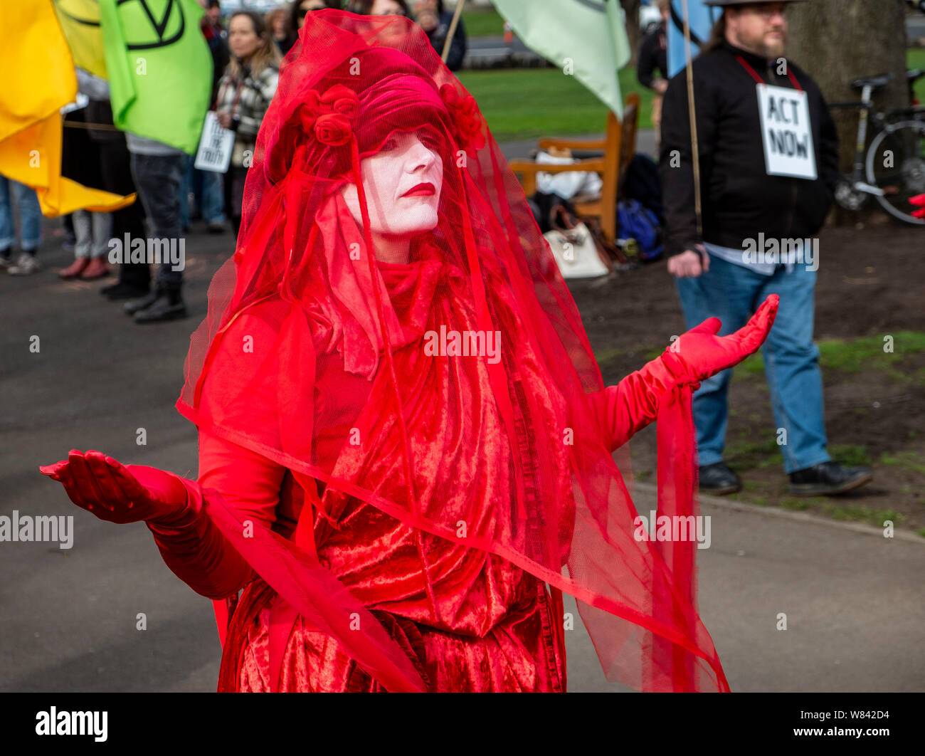 Members of the performance group known as the Red Brigade at The Extinction Rebellion protest against climate change inaction, outside the Tasmanian Parliament in Hobart, today (Thursday, August 8, 2019) Stock Photo