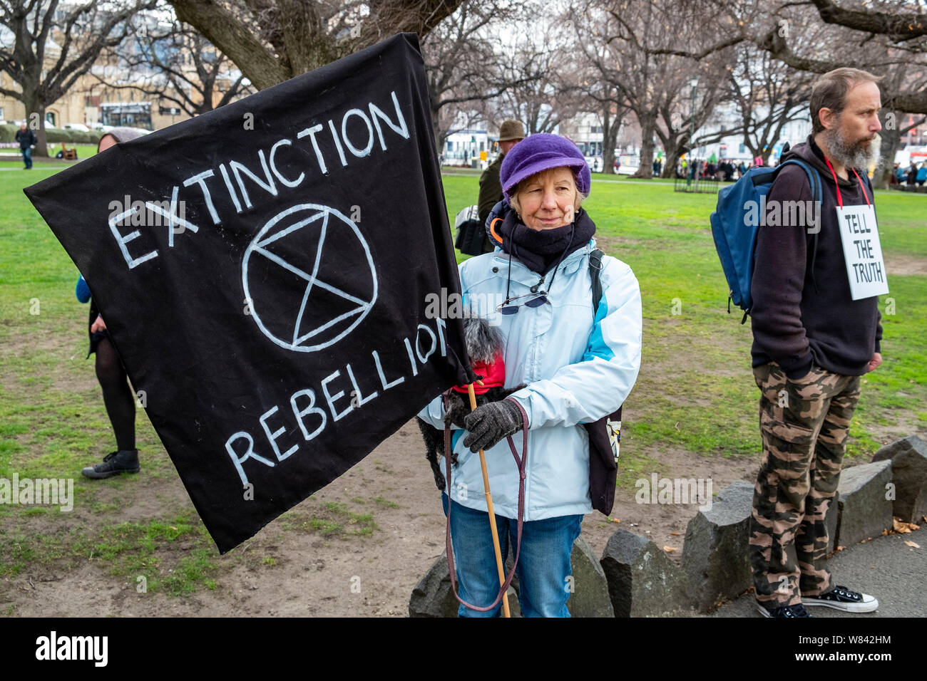 An elderly woman with her dog at The Extinction Rebellion protest against climate change inaction, outside the Tasmanian Parliament in Hobart, today (Thursday, August 8, 2019) Stock Photo