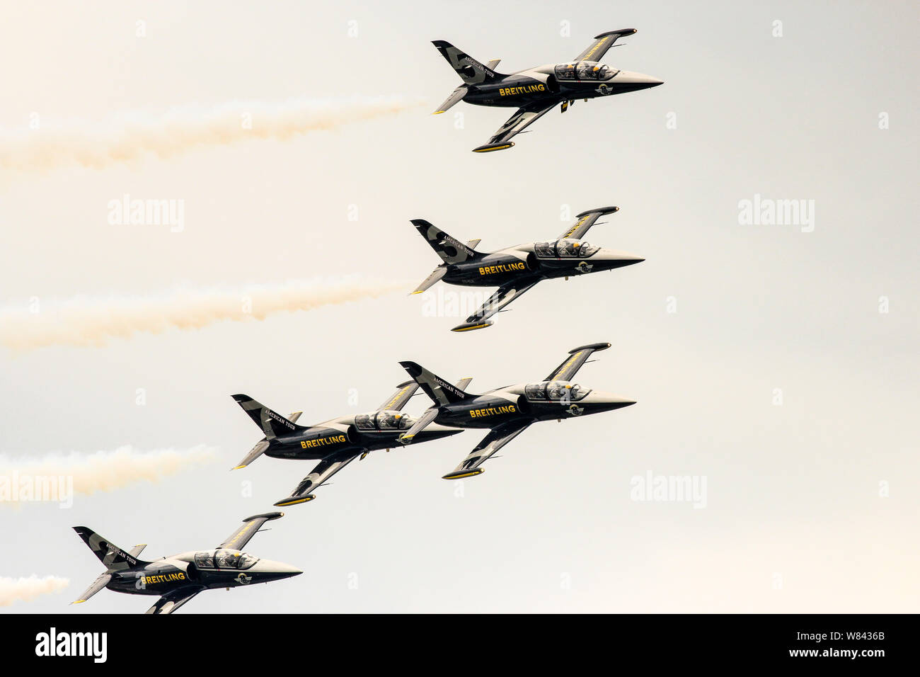Breitling Jet Team performing fascinating aerobatic stunts in the sky in an airshow Stock Photo