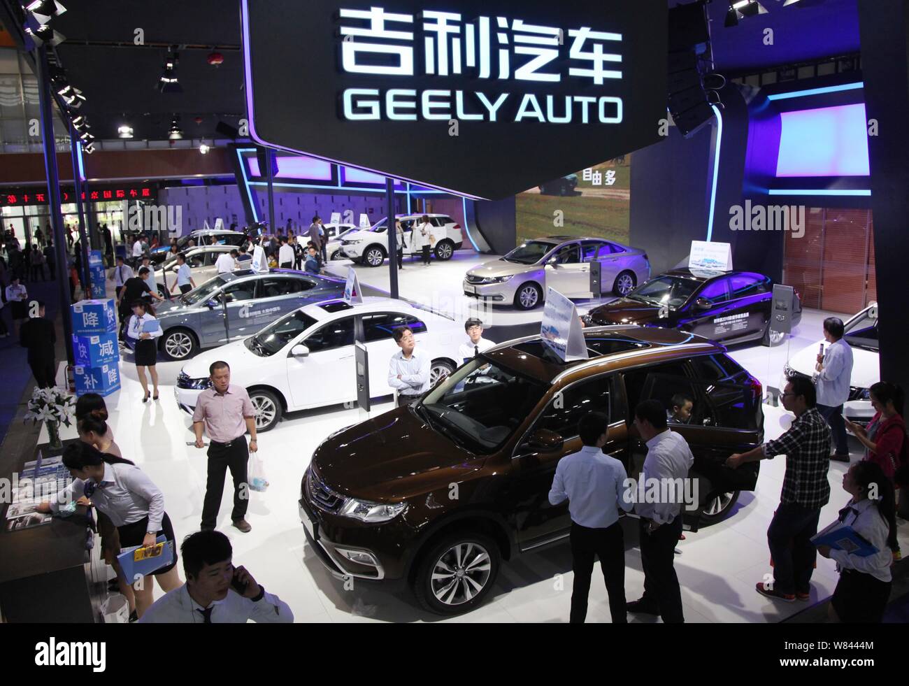 --FILE--People visit the stand of Geely during an automobile exhibition in Nanjing city, east China's Jiangsu province, 2 October 2016.   Volvo Cars a Stock Photo