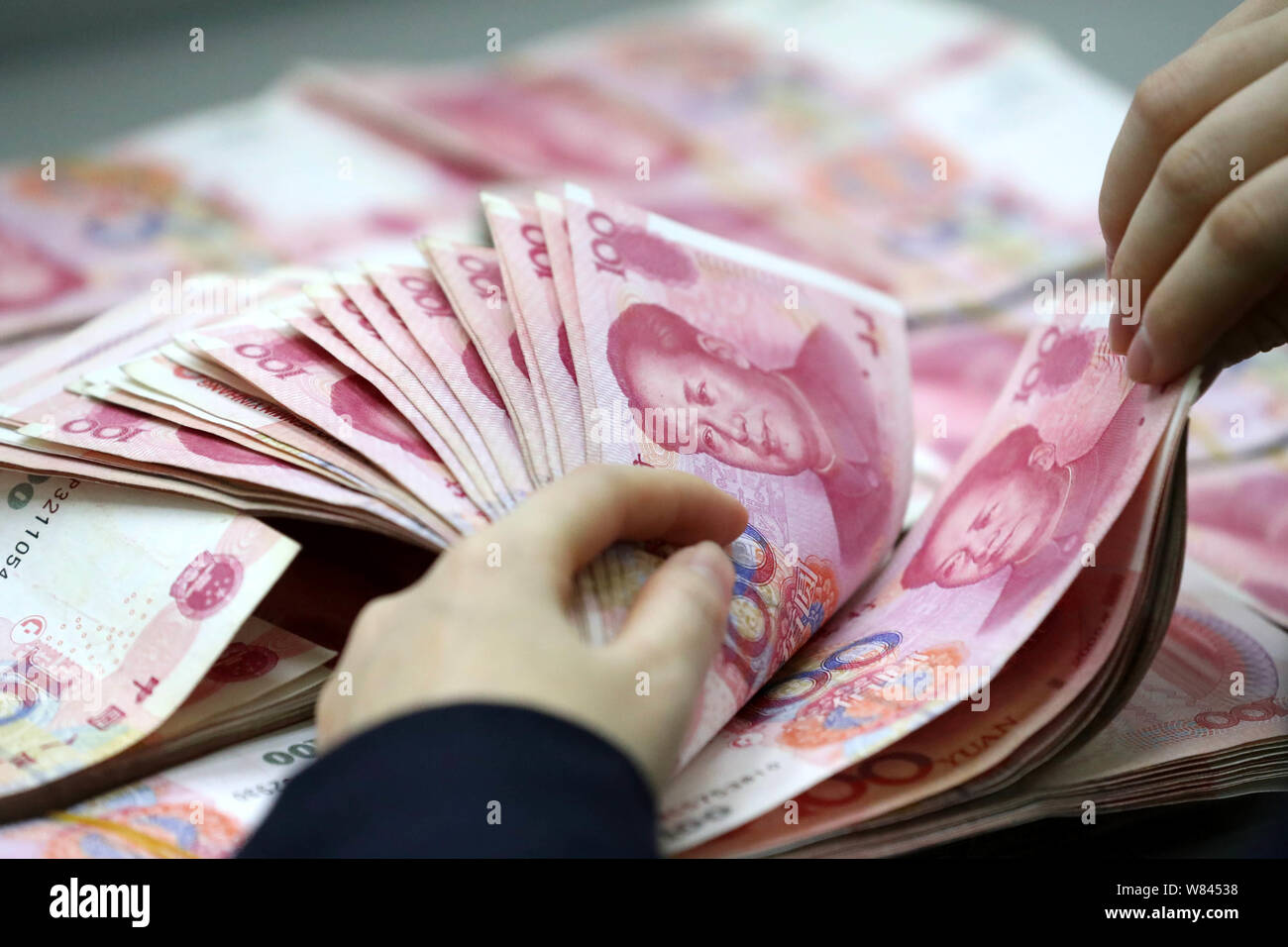 Counting Rmb Current conditions are china hi-res stock photography and images - Alamy