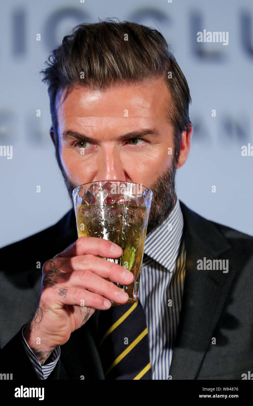 English soccer star David Beckham drinks at a press conference to promote  Haig Club whisky in Shanghai, China, 8 November 2016 Stock Photo - Alamy