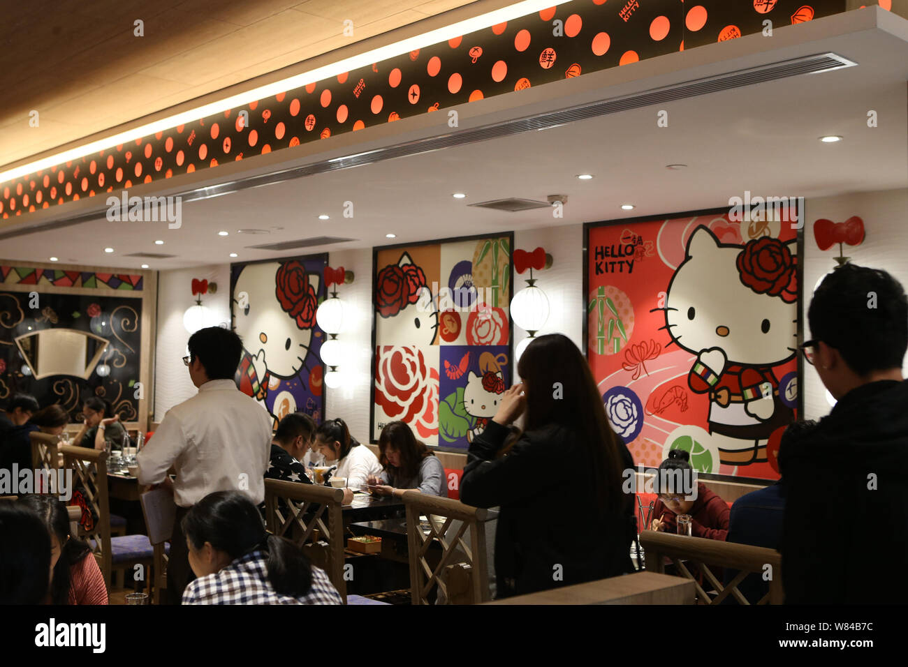 Young people order food at the Hello Kitty hotpot restaurant in
