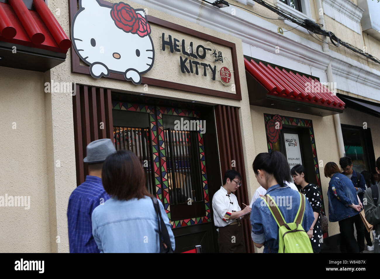 Young people visit the Hello Kitty hotpot restaurant in Shanghai