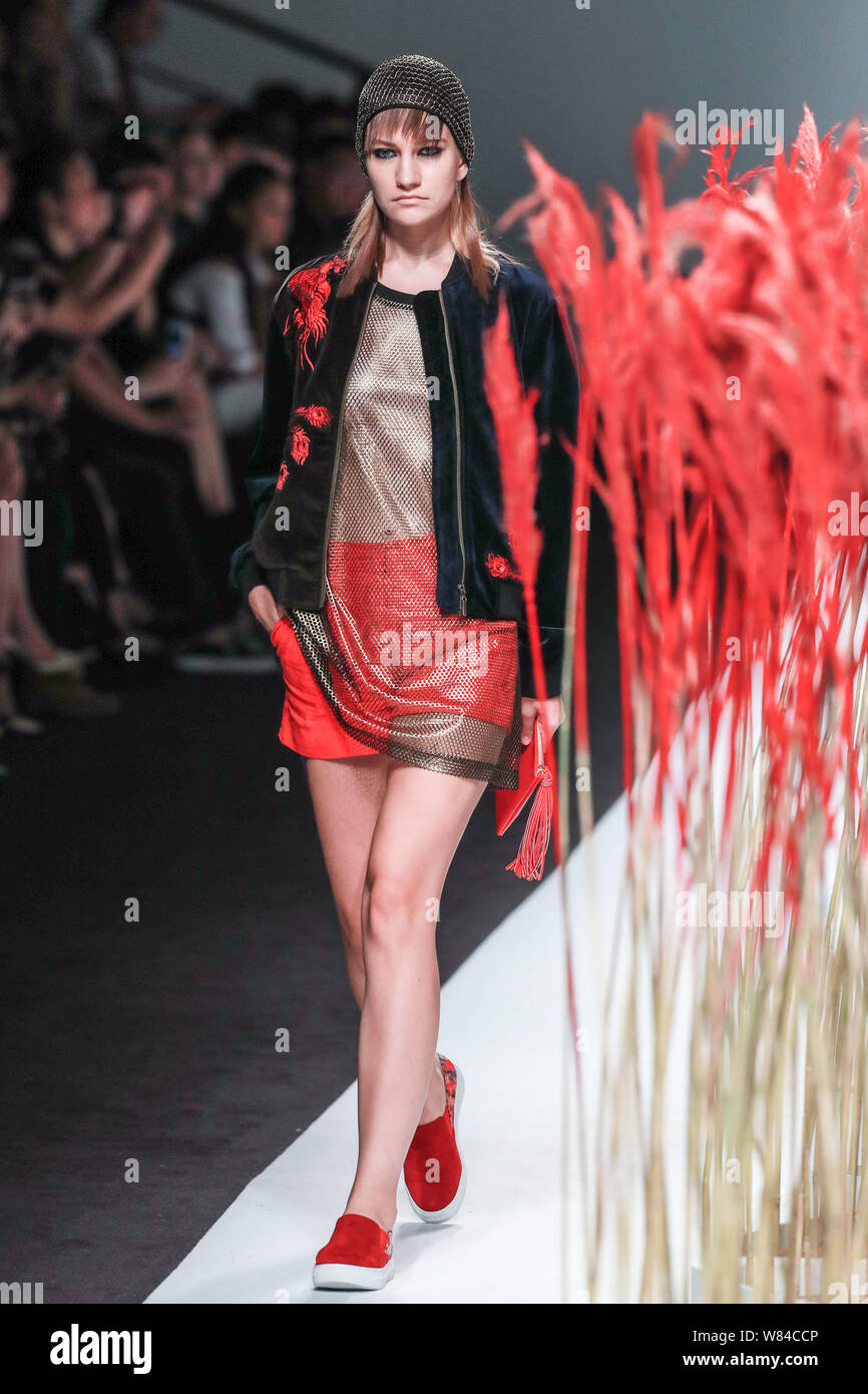 A model displays a new creation at the fashion show of Ji Cheng during ...