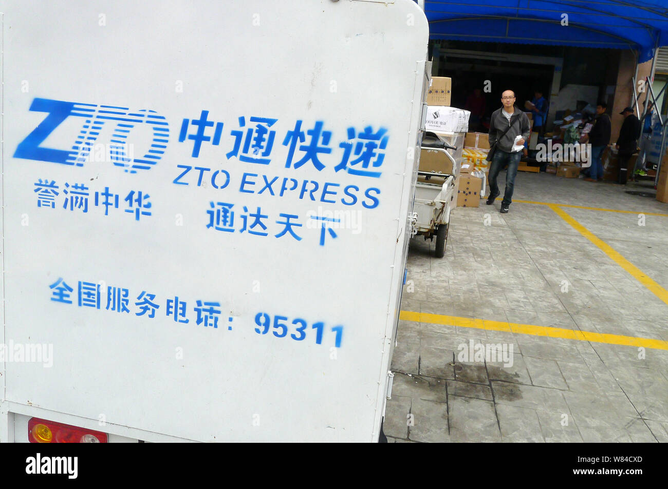 FILE--A Chinese courier of ZTO Express rides his motorcycle fully loaded  with parcels, most of which are from online shopping, on a road in Changde  Stock Photo - Alamy