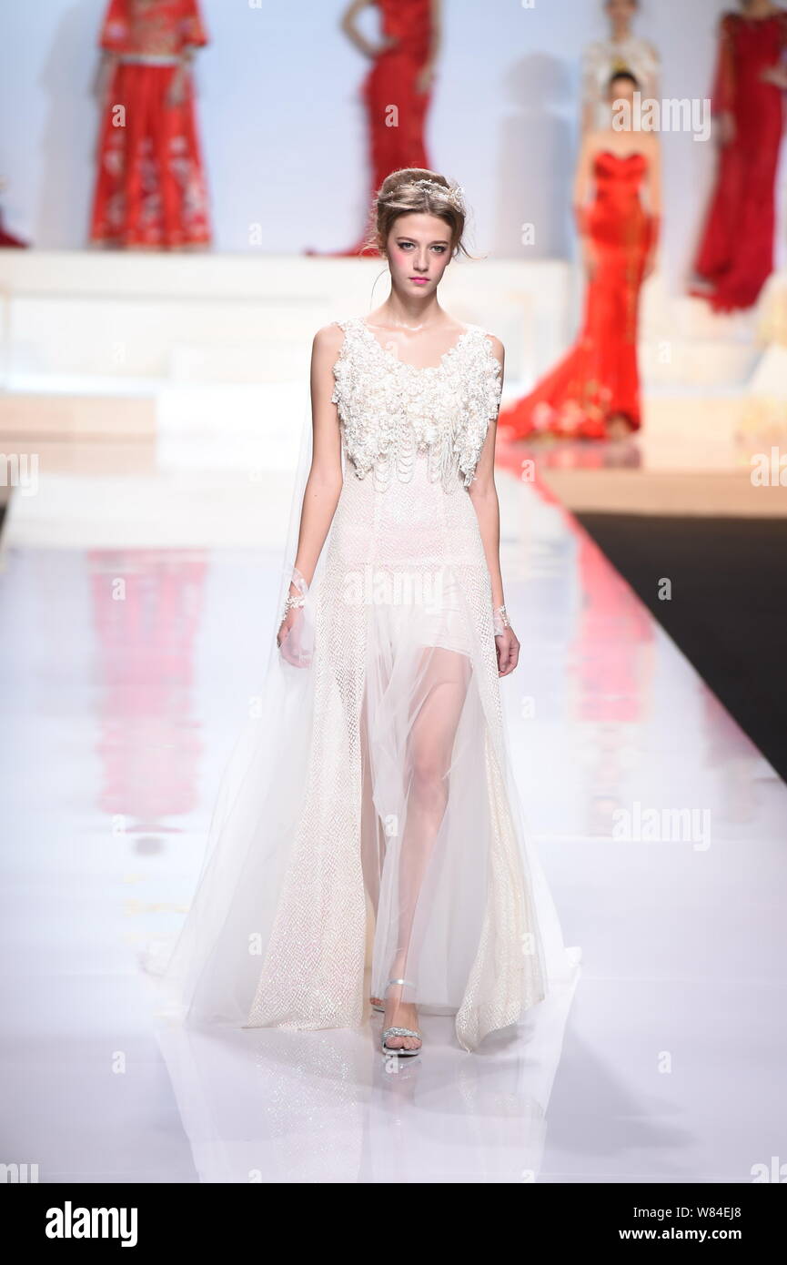 A model displays a new creation at the fashion show of Tsai Meiyue by ...