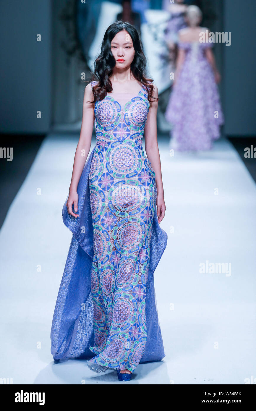 A model displays a new creation at the fashion show of J.Queen & Little ...