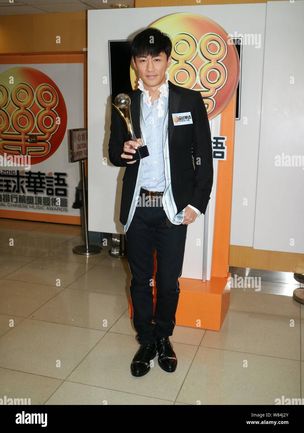 Hong Kong singer and actor Raymond Lam poses with his trophy at the 2016 Global Chinese Music Awards in Hong Kong, China, 19 October 2016. Stock Photo
