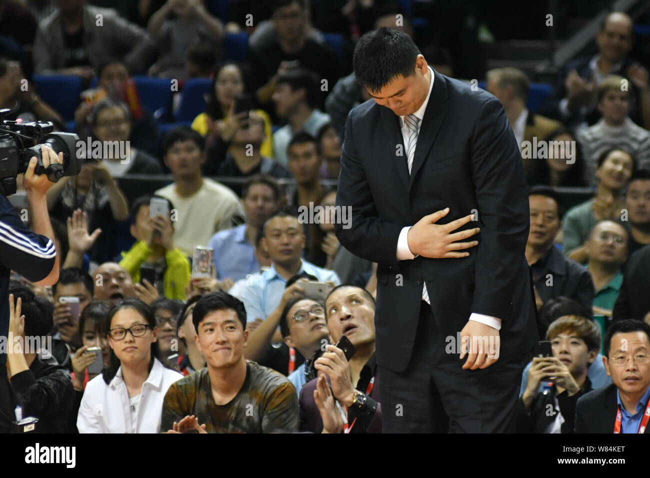 Retired Chinese basketball superstar Yao Ming arrives for the basketball match between Houston Rockets and New Orleans Pelicans during the NBA China G Stock Photo