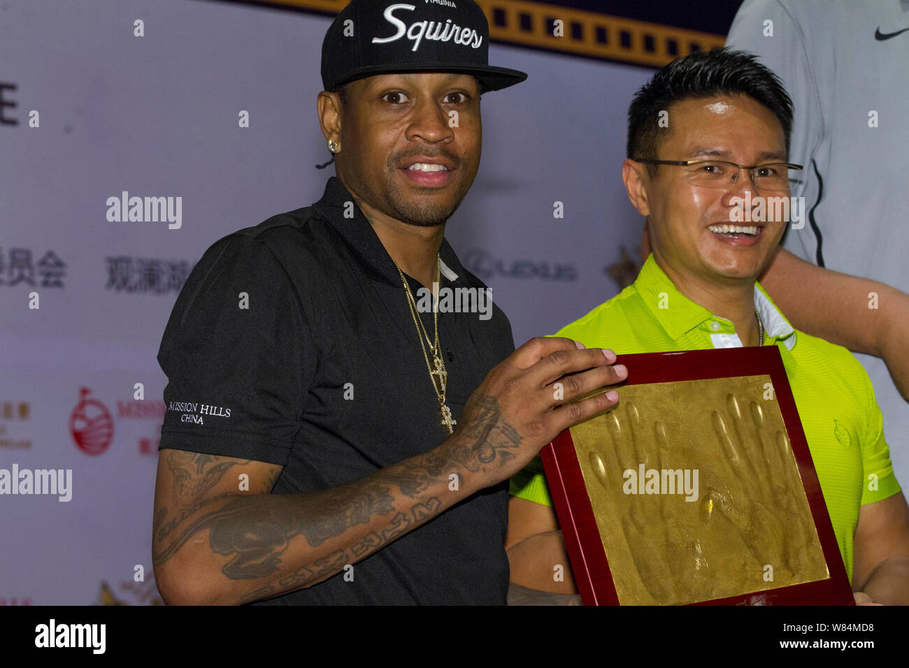 Pro Hanprint Retired NBA star Allen Iverson, left, shows his handprint at a press ...