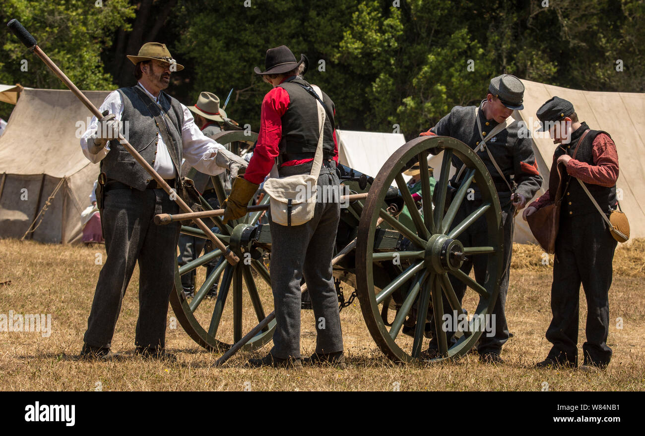 Duncan Mills, Calif - July 14, 2012: Men prime a canon during Civil War Reenactment Stock Photo