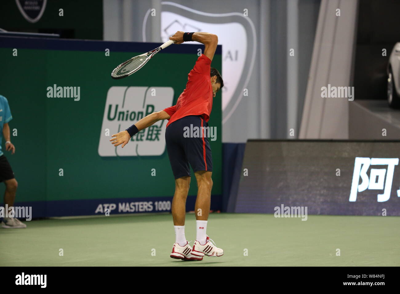 Novak Djokovic of Serbia smashes his racquet as he competes against Roberto Bautista Agut of Spain in their men's singles semifinal match during the 2 Stock Photo