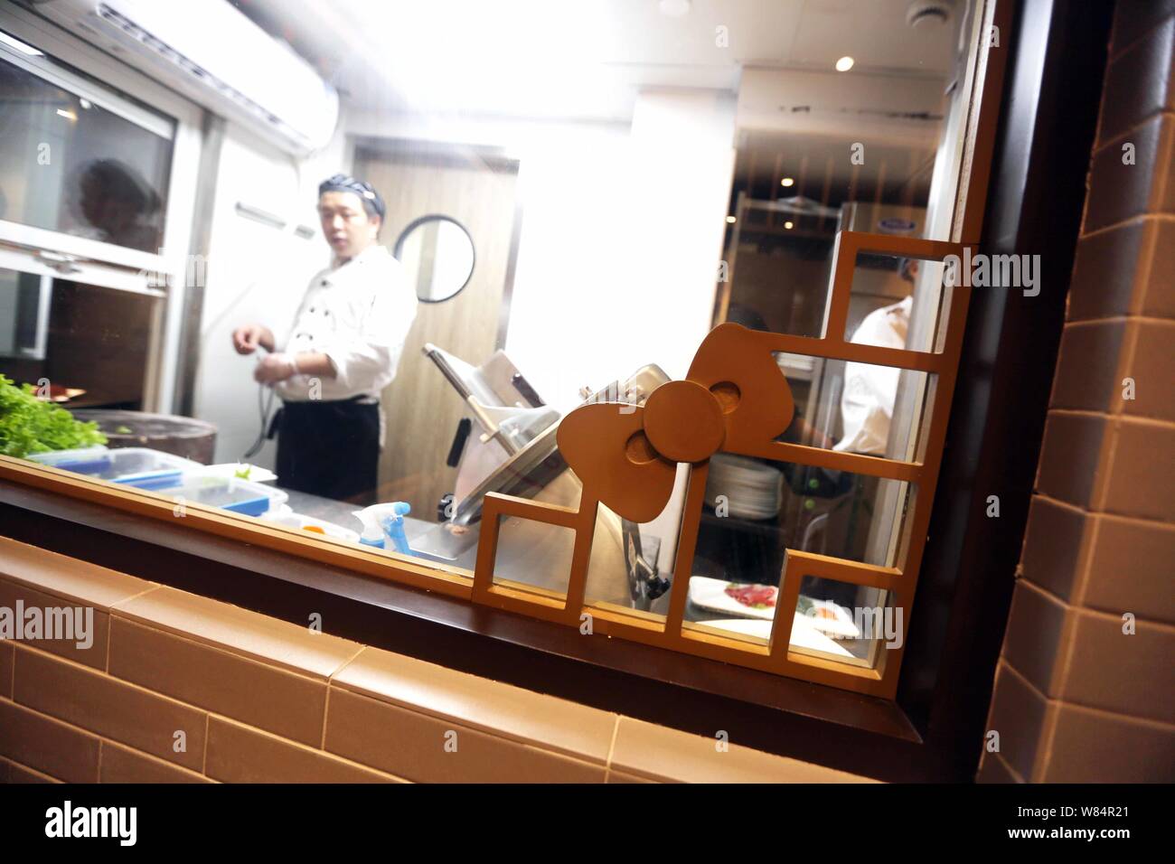 Cooks Prepare Food In The Kitchen At The Hello Kitty Hot Pot