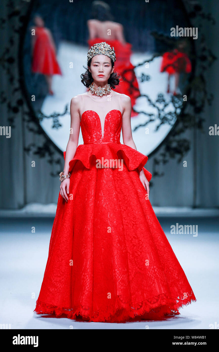 A model displays a new creation at the fashion show of J.Queen & Little ...