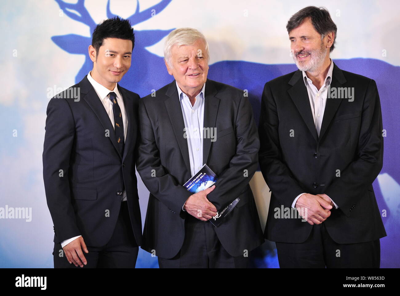 (From left) Chinese actor Huang Xiaoming, French directors Jacques Perrin and Jacques Cluzaud attend a premiere conference of the documentary movie 'T Stock Photo