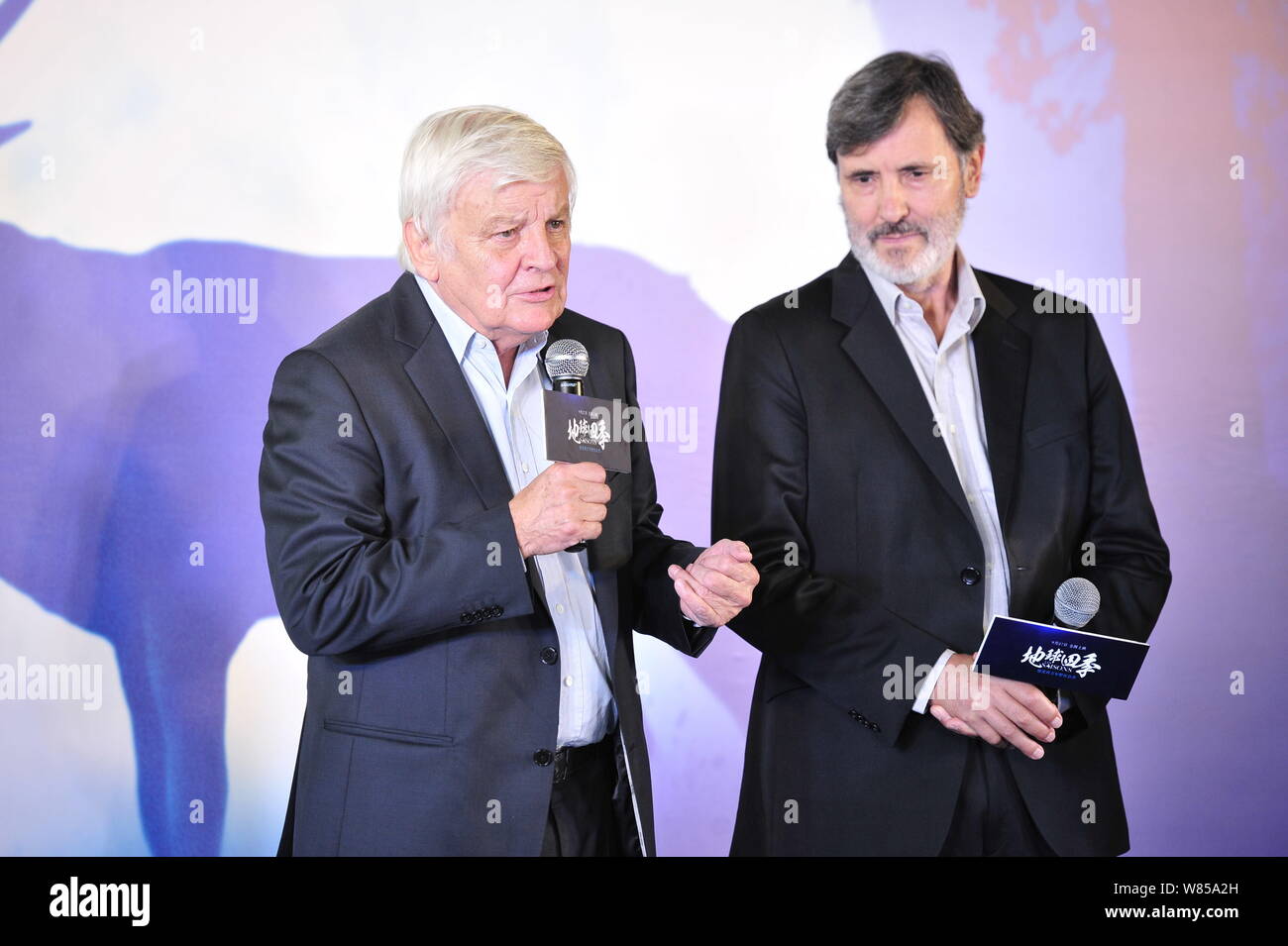 French directors Jacques Perrin, left, and Jacques Cluzaud attend a premiere conference of the documentary movie 'The Seasons' in Beijing, China, 25 S Stock Photo