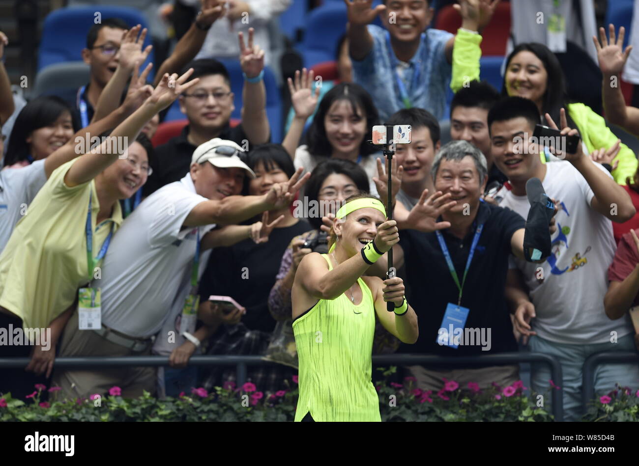 Lucie Safarova of Czech Republic takes selfies with fans after defeating Varvara Lepchenko of the United States during their women's singles of the 20 Stock Photo