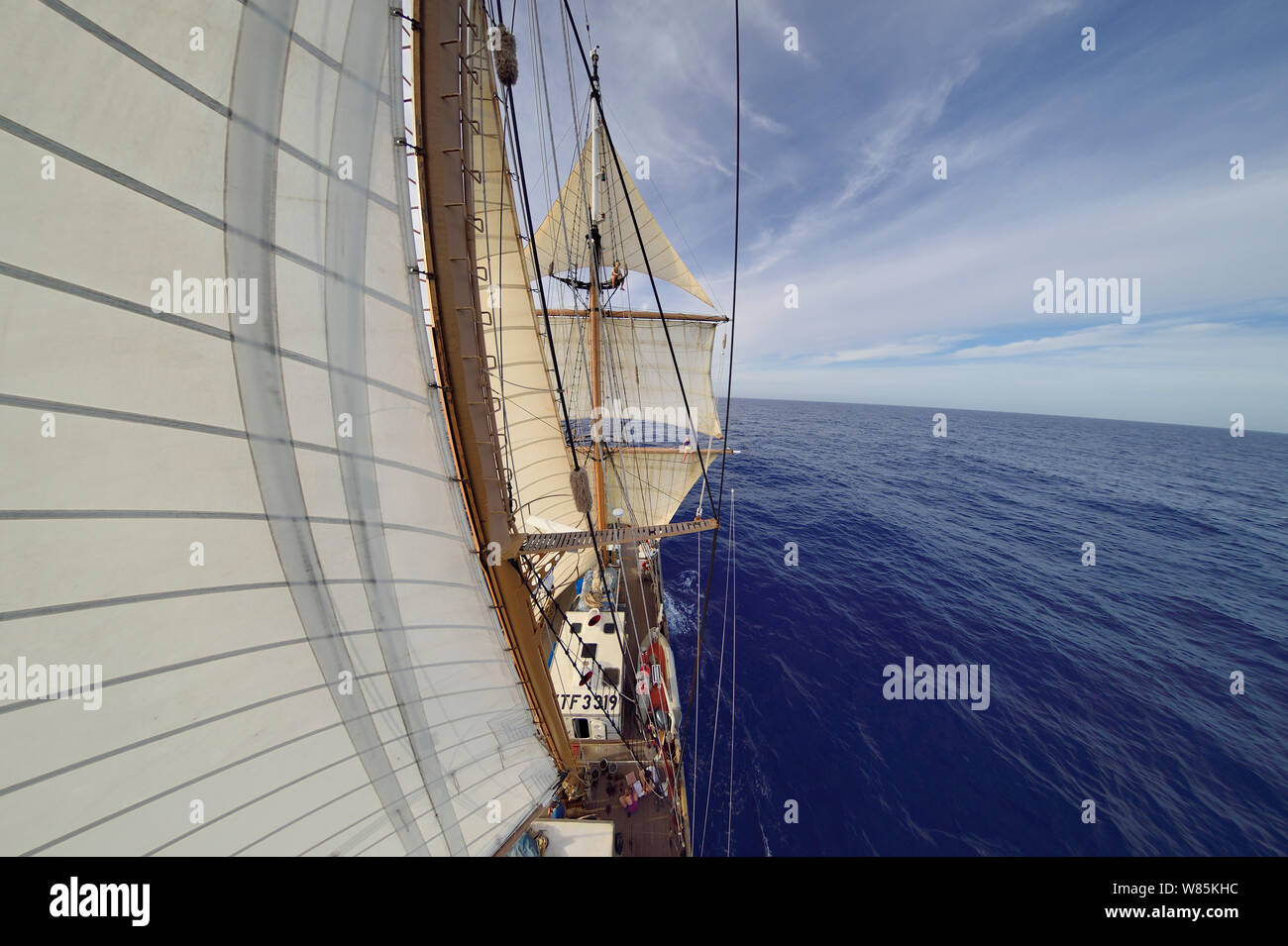 Fish eye view of sails of Corwith Cramer, 134-foot steel brigantine research vessel, Sargasso Sea, Bermuda, April. Stock Photo