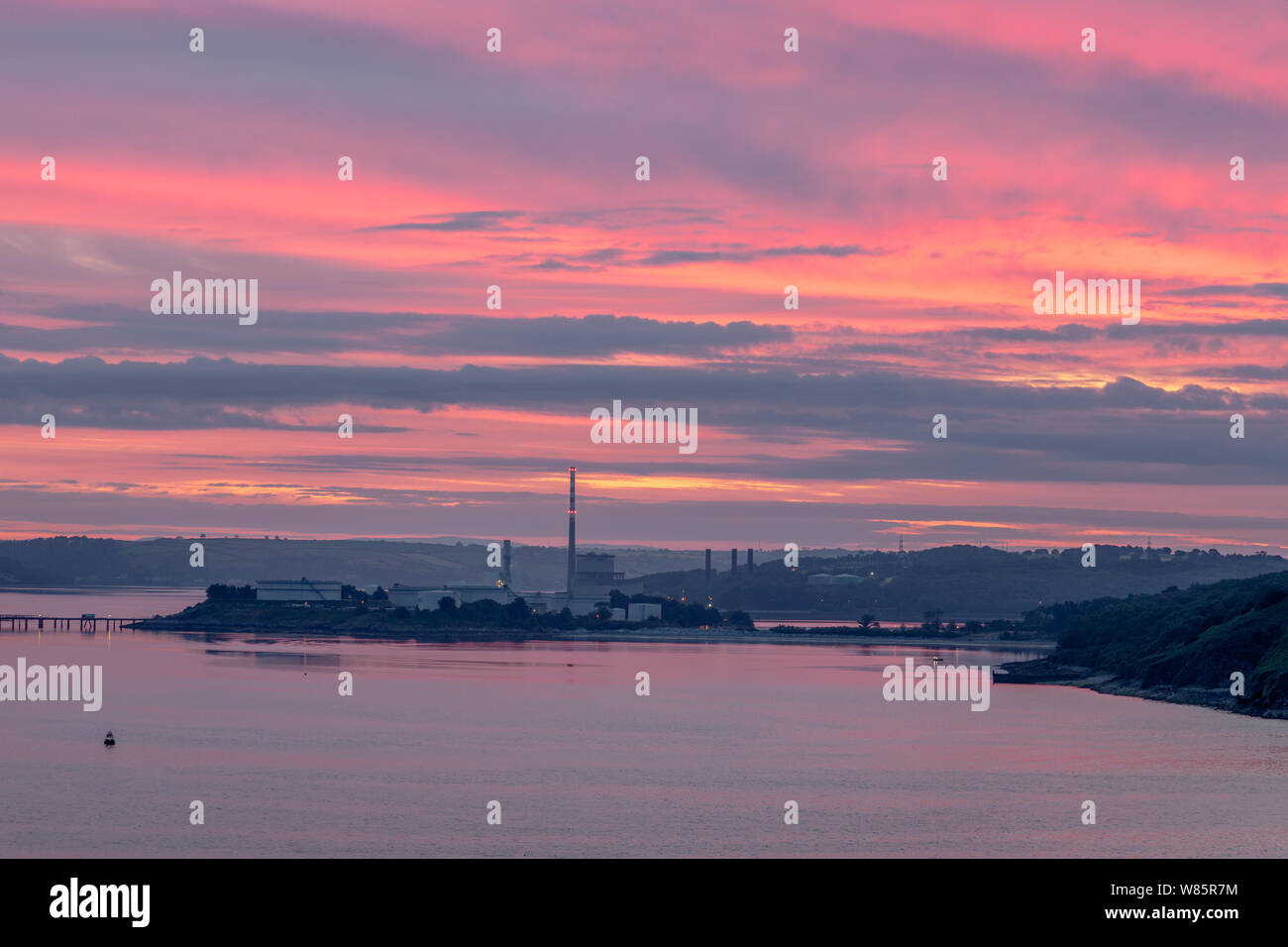 Whitegate, Cork, Ireland. 08th August, 2019. A red dawn morning over the Oil refinery and the ESB generating Station at Whitegate, Co. Cork, Ireland. - Credit;  David Creedon / Alamy Live News Stock Photo
