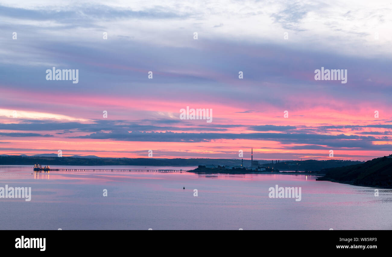 Whitegate, Cork, Ireland. 08th August, 2019. A red dawn morning over the Oil refinery and the ESB generating Station at Whitegate, Co. Cork, Ireland. - Credit;  David Creedon / Alamy Live News Stock Photo
