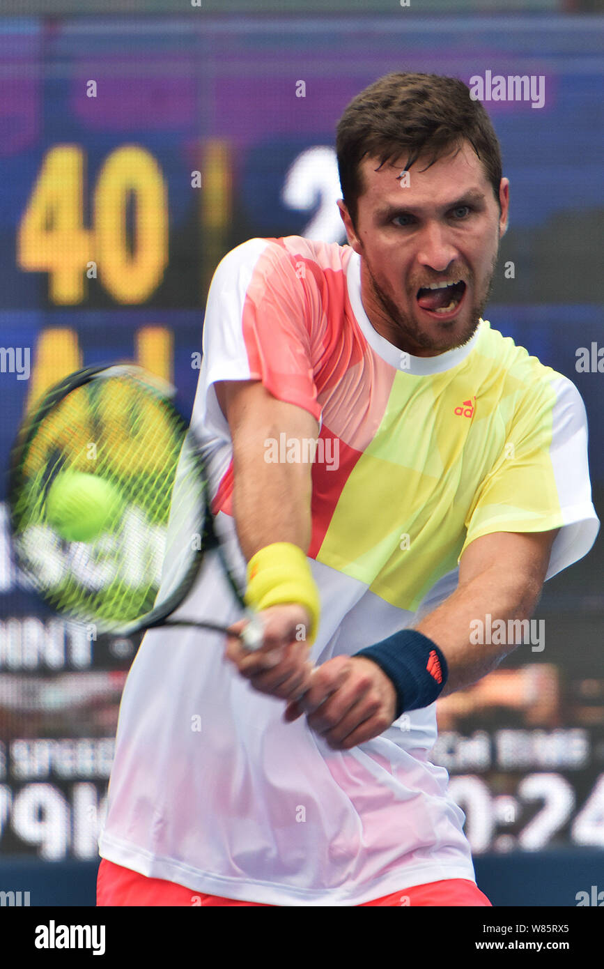 Mischa Zverev of Germany returns a shot to Li Zhe of China in their ...