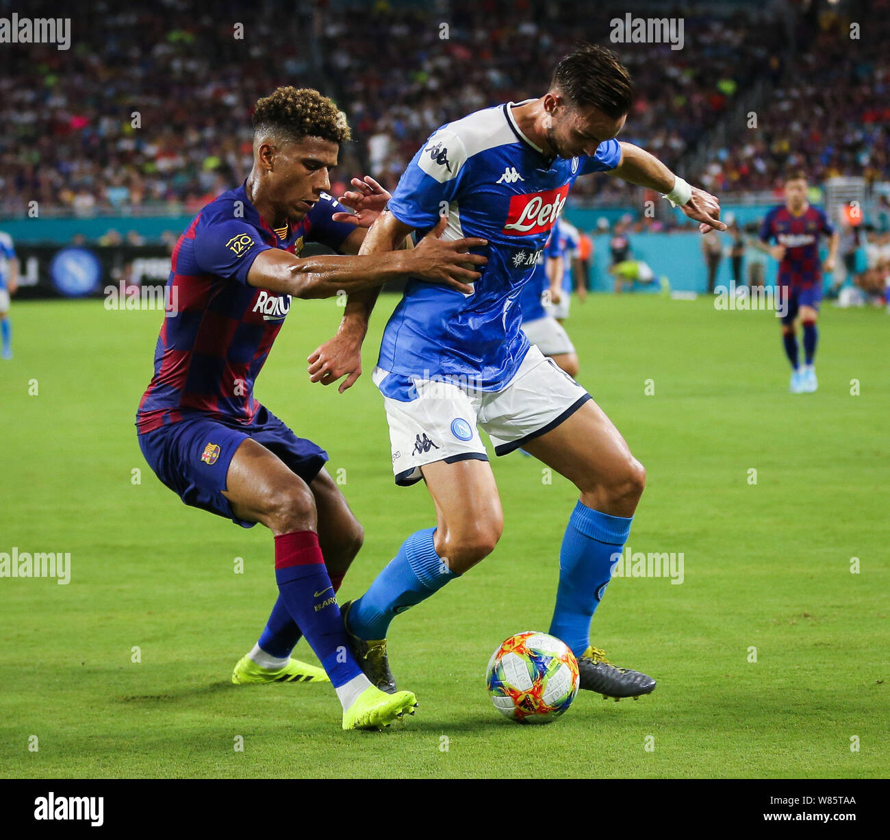 Miami Gardens, Florida, USA. 7th Aug, 2019. SSC Napoli midfielder Fabian Ruiz Pena (8) battles for the ball with FC Barcelona defender Jean-Clair Todibo (6) during a friendly match between FC Barcelona and SSC Napoli at the Hard Rock Stadium in Miami Gardens, Florida. Credit: Mario Houben/ZUMA Wire/Alamy Live News Stock Photo