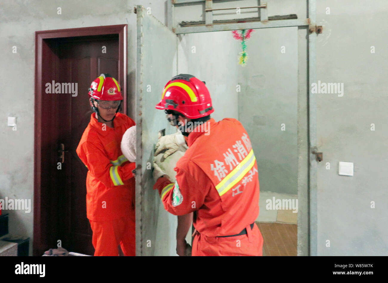 Chinese firefighters try to release the head of the drunken man stuck ...