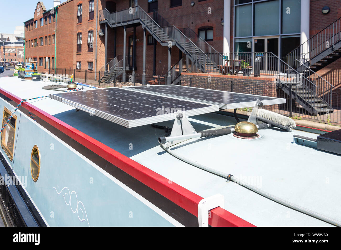 Solar panels on top of canal boat, The Worcester and Birmingham Canal, Gas Street Basin, Birmingham, West Midlands, England, United Kingdom Stock Photo