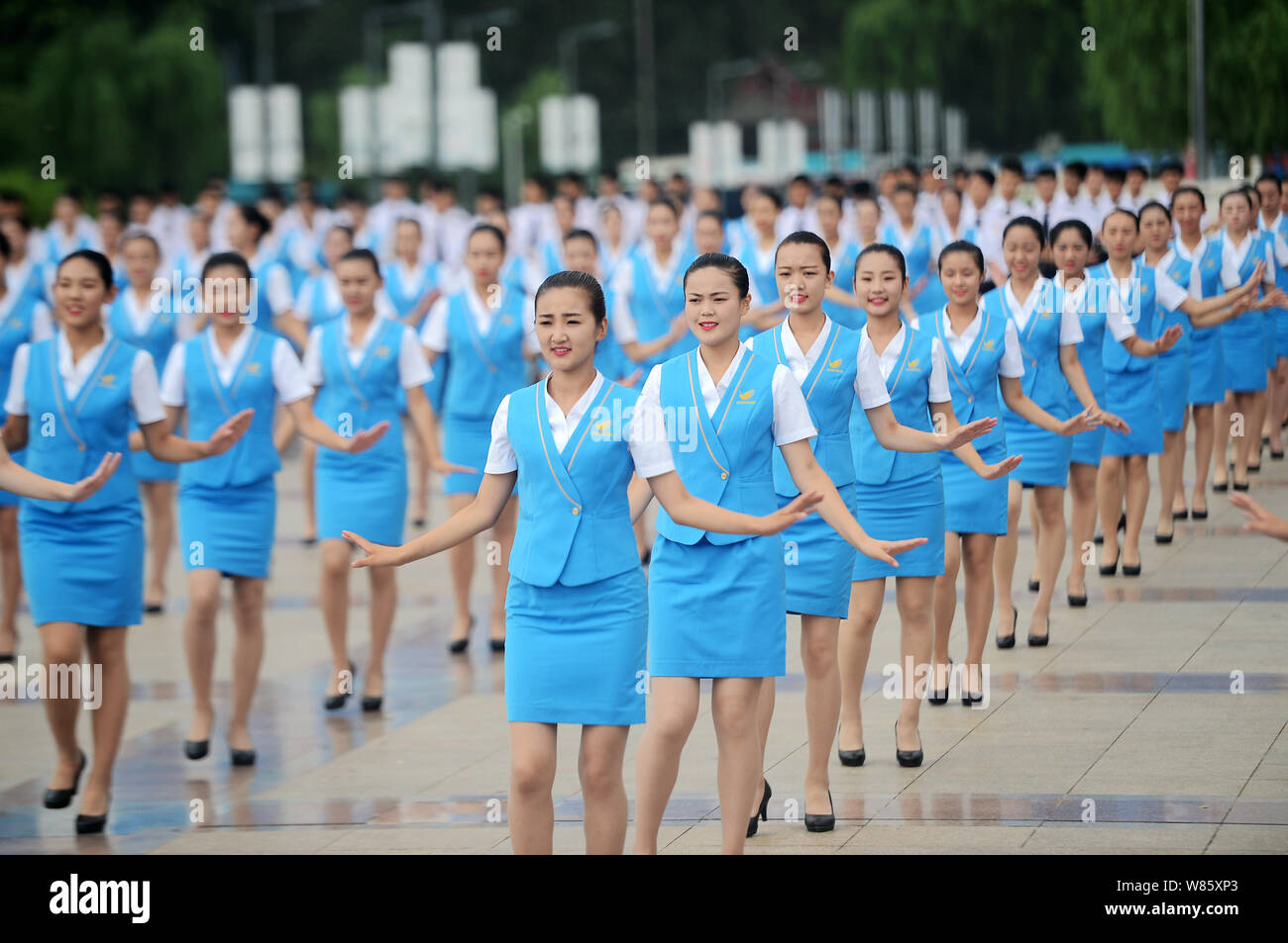 Chinese students from a local civil aviation school dance during a flash mob  event at Quancheng Square in Ji'nan city, east China's Shandong province  Stock Photo - Alamy