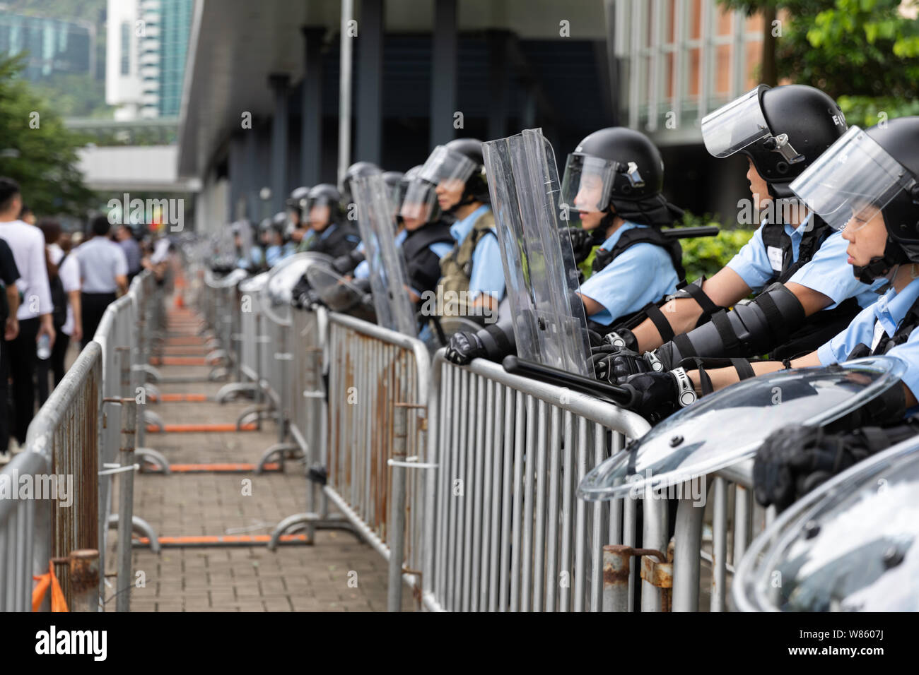 12th June 2019 During an Anti Extradition Bill protest outside the government offices in Admiralty. Riot police with riot shields surrounding the Legislative Council building. Stock Photo