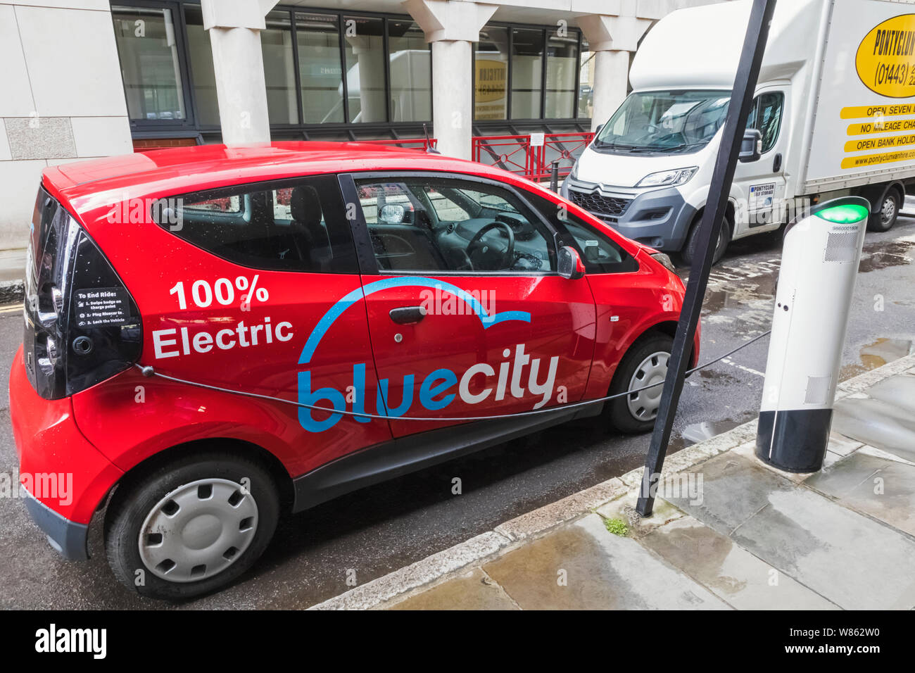 England, London, Electric Bluecity Rental Car at Charging Point Stock
