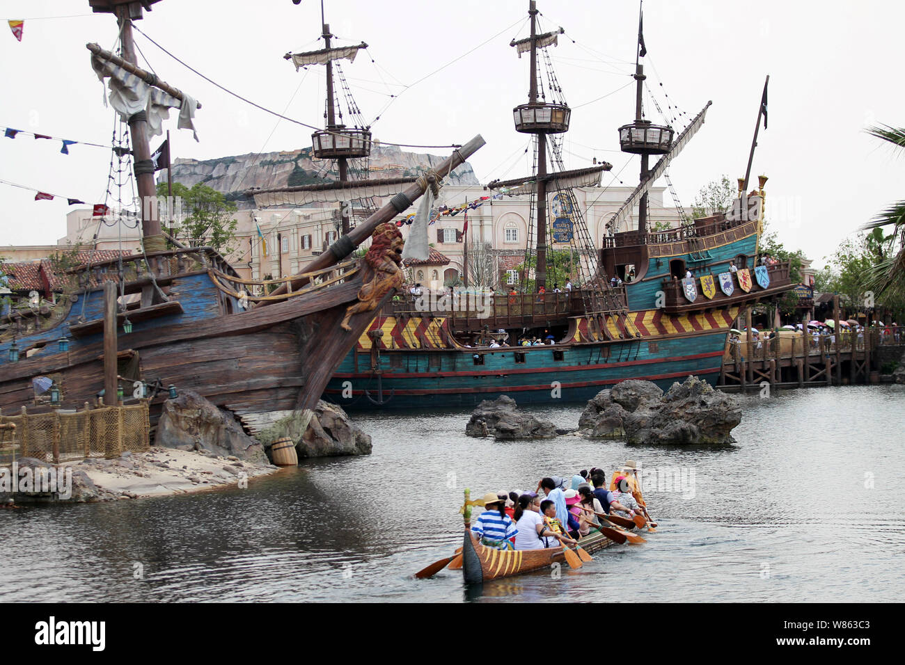 --FILE--Tourists rows a canoe to try out the Explorer Canoes in the Shanghai Disneyland at the Shanghai Disney Resort in Pudong, Shanghai, China, 23 J Stock Photo