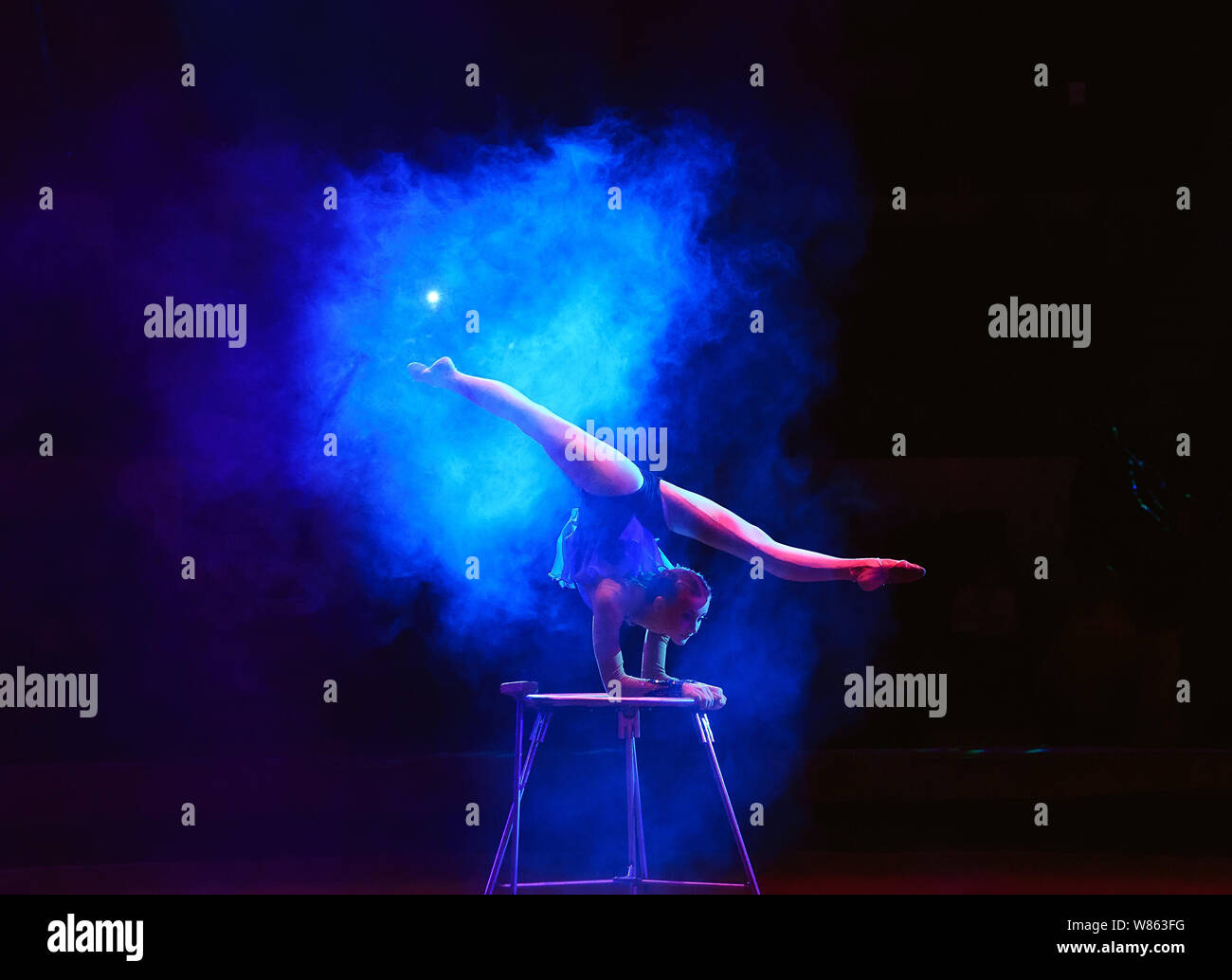 Performance of the acrobat girl in the circus Stock Photo - Alamy