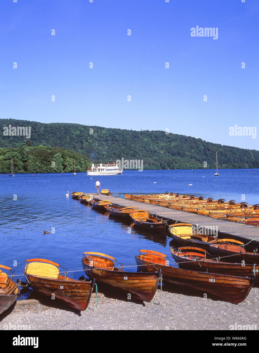 Cruise boat and rowing boats on Lake Windermere, Bowness-on-Windermere, Lake District National Park, Cumbria, England, United Kingdom Stock Photo