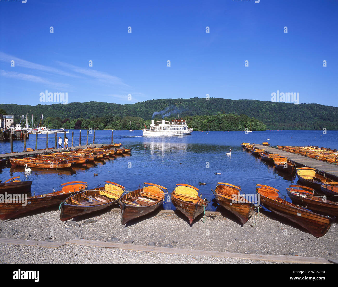 Cruise boat and rowing boats on Lake Windermere, Bowness-on-Windermere, Cumbria, England, United Kingdom Stock Photo