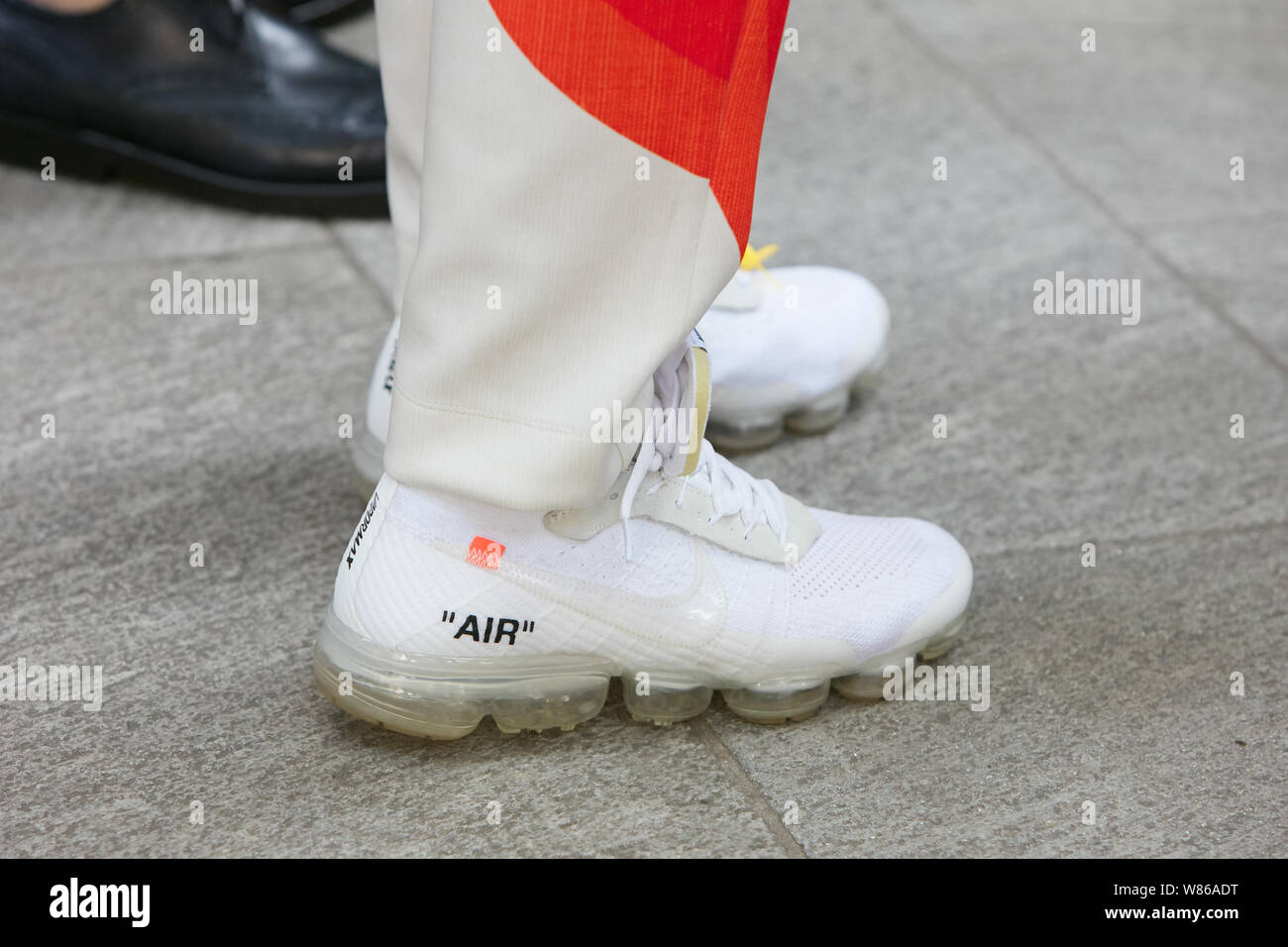 MILAN, ITALY - JUNE 15, 2019: Man with white Nike Vapormax Off White  sneakers before Emporio Armani fashion show, Milan Fashion Week street  style Stock Photo - Alamy